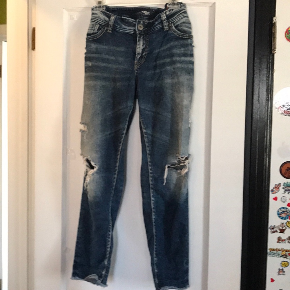 Distressed blue jeans